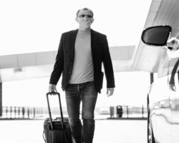 Man with trolley at airport